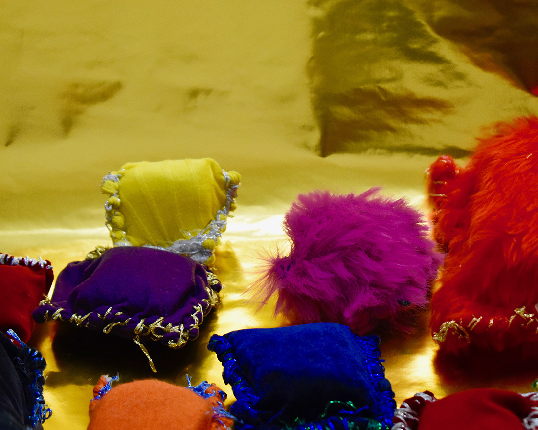 Small textile cushion like sculptures made from different coloured fabrics