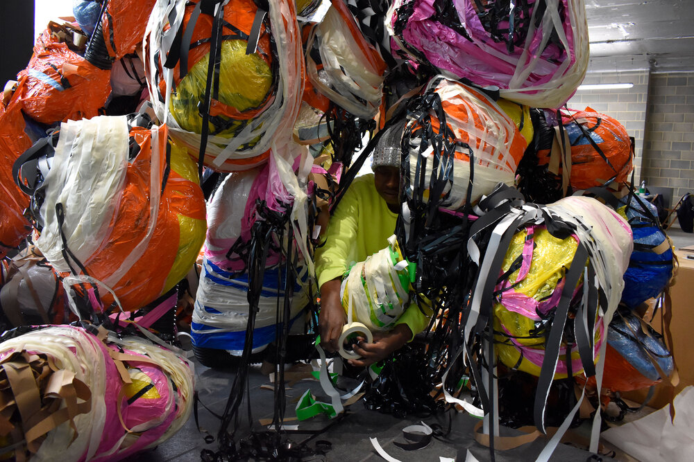 Nnena Kalu working on an installation