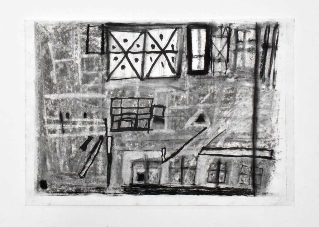 An image of a small, rectangle, drawing in black charcoal. Windows emerge from abstract shapes ,lines, and shadows.