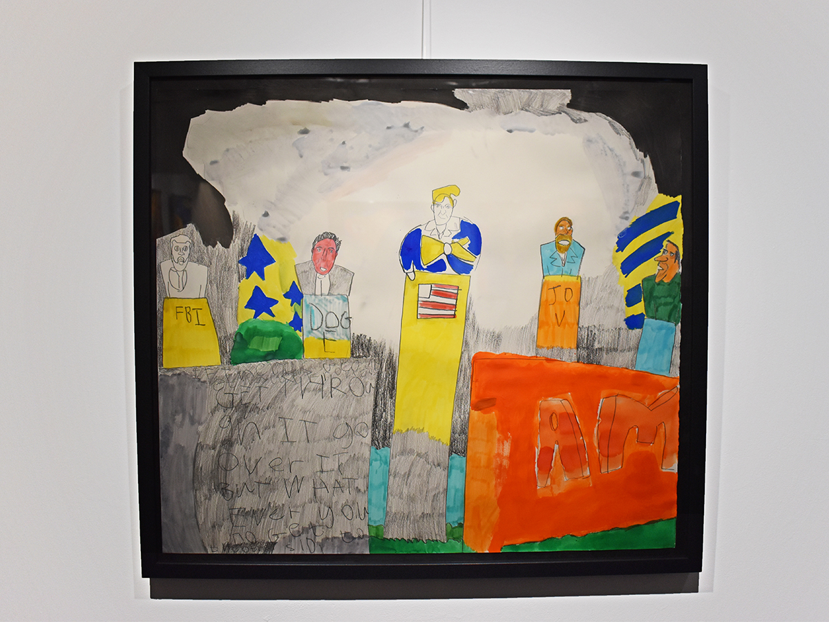 Image of a framed artwork hung on a wall. A coloured pencil drawing of five political figures speaking on podiums.